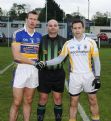 St.Mary's Rasharkin Captain Paul Doherty and St.Brigid's Captain Brian McMahon with referee Gary Brown (Con Magees Glenravel)